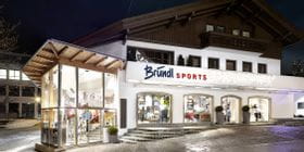 Bründl Sports Mayrhofen Zentrum well-lit shopwindow - evening view <br/>
