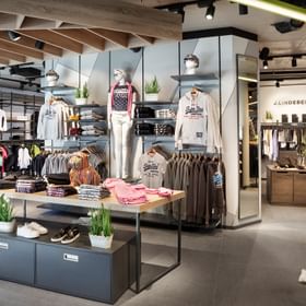 Bright and welcoming shop floor at Bründl Sports Orgler<br/>