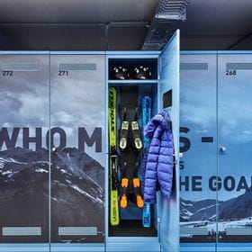 Depot locker which is open and shows some skiing equipment