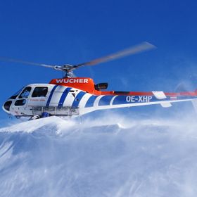 Heli on a hill, you can see the snow blowing away.