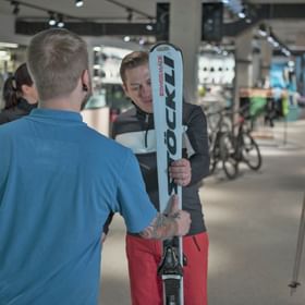 rented skies are handed over to a customer