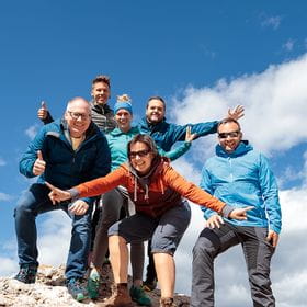 a group of hikers on a rock