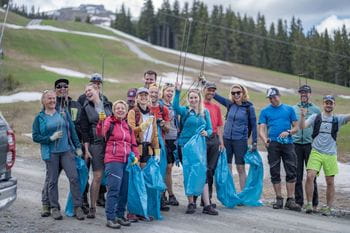 People collecting garbage on the slope