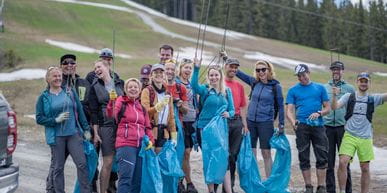 People collecting garbage on the slope