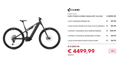 Black Cube Stereo Hybrid ONE44 HPC SLX 800 electric mountain bike with kickstand, front light, rear rack, and mudguards offered as a discounted accessory bundle for €4,499.99.