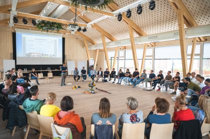 Bründl employees seating in a circle