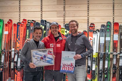 Three people in a sports shop 