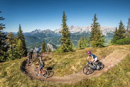 three bikers are on their way in Schladming