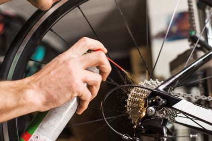 a bycicle chain is lubricated with a spray