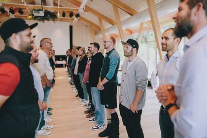 The managers face each other during an exercise and look each other in the eye.