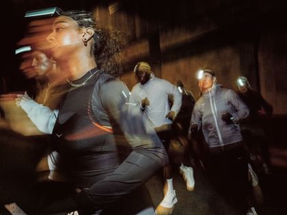 Street Runners at night wearing Hoka apparel