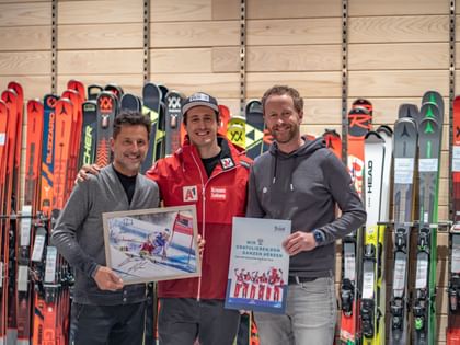 Three people in a sports shop 