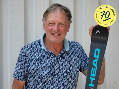 Ski legend Franz Klammer holding a HEAD ski