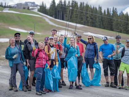 People collecting garbage on the slope