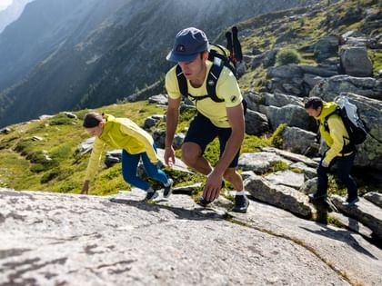 Hiking Group with Mammut gear hiking up a rock face