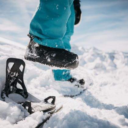 a detailed shot on someone who is steppin into the Burton Step on Binding