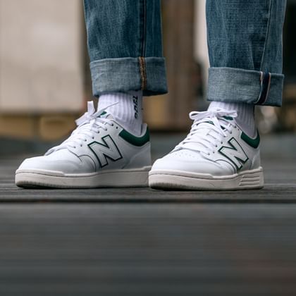 You can see new white New Balance Sneakers