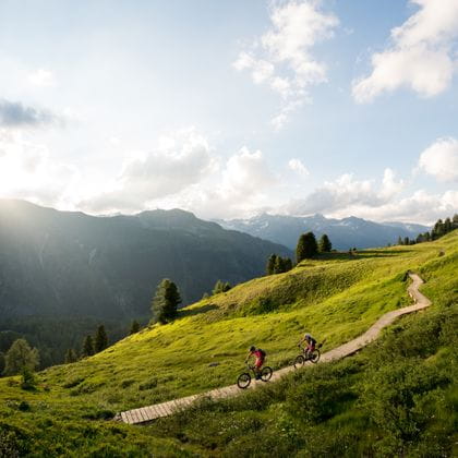 two bikers in a mountainous landscape