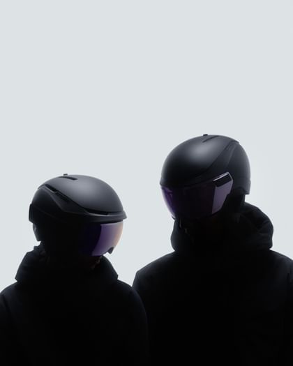 Atomic Revent Two skiers wearing Atomic Revent helmets with visors.
