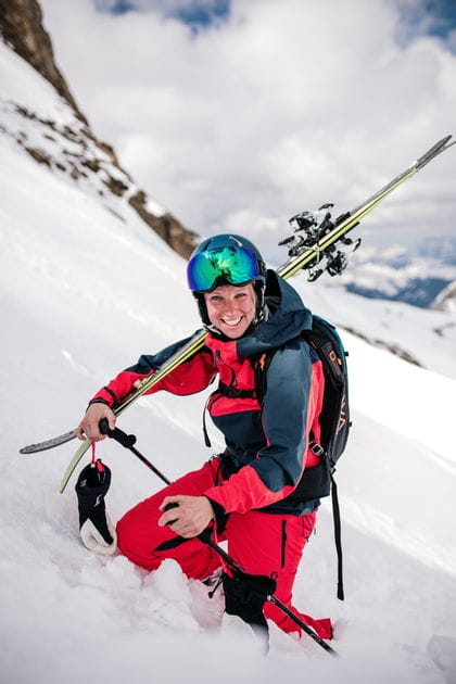Freerider with skiis on the shoulder